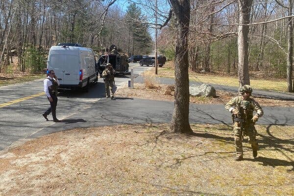 Law enforcement personnel outside the home of Airman First Class Jack Teixeira’s mother in North Dighton, Mass., on Thursday. The F.B.I. had been zeroing in on him for several days.