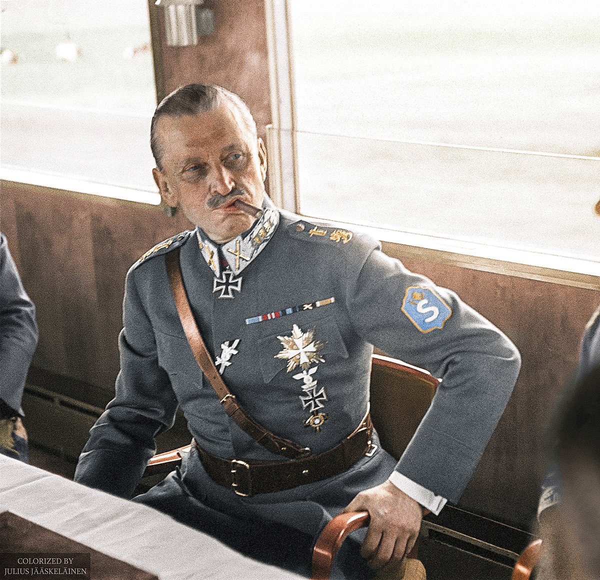 1200px-Marshal_of_Finland_Carl_Gustaf_Emil_Mannerheim_having_a_cigar_in_a_train_during_his_visit_in_Germany%2C_1942._%2849960472022%29.jpg