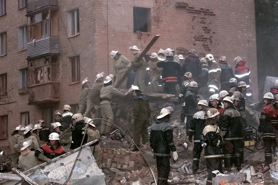 Rescuers work on the ruins of a leveled Moscow apartment building.