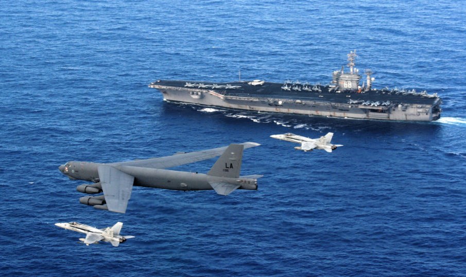US_Navy_080423-F-0017C-003_A_B-52_Stratofortress_is_intercepted_by_two_Navy_F-A-18_Hornets_as_it_flies_past_the_aircraft_carrier_USS_Nimitz_CVN_68-905x539.jpg