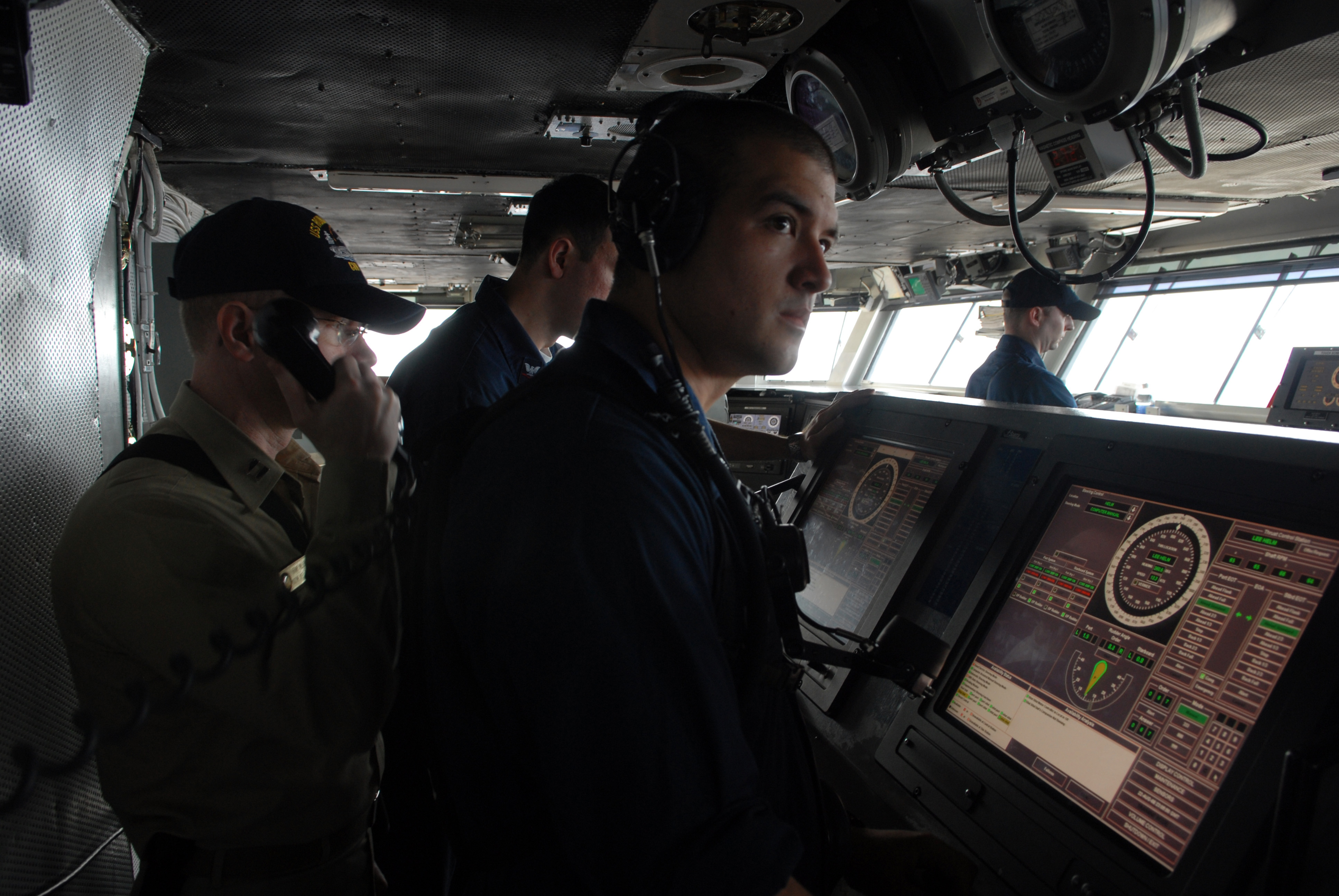 US_Navy_080823-N-1635S-003_Watch_standers_man_the_helm_on_the_bridge_of_the_Nimitz-class_aircraft_carrier_USS_Ronald_Reagan_(CVN_76)_during_a_replenishment_at_sea_with_the_Military_Sealift_Command_fast_combat_support_ship_USNS.jpg