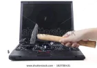 stock-photo-girls-hand-smashing-laptop-with-a-hammer-isolated-on-white-162708431[1].webp