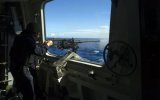 USS-Zumwalt-sailor-firing-a-.50cal-heavy-machine-gun-.jpg