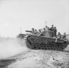 A_Churchill_tank_carrying_infantry_advances_towards_St_Pierre_Tarentaine,_Normandy,_3_August_1...jpg