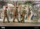 berlin-file-1989-12-15-east-german-border-guards-patrolling-the-berlin-wall-in-east-germany-de...jpg