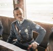 1200px-Marshal_of_Finland_Carl_Gustaf_Emil_Mannerheim_having_a_cigar_in_a_train_during_his_vis...jpg