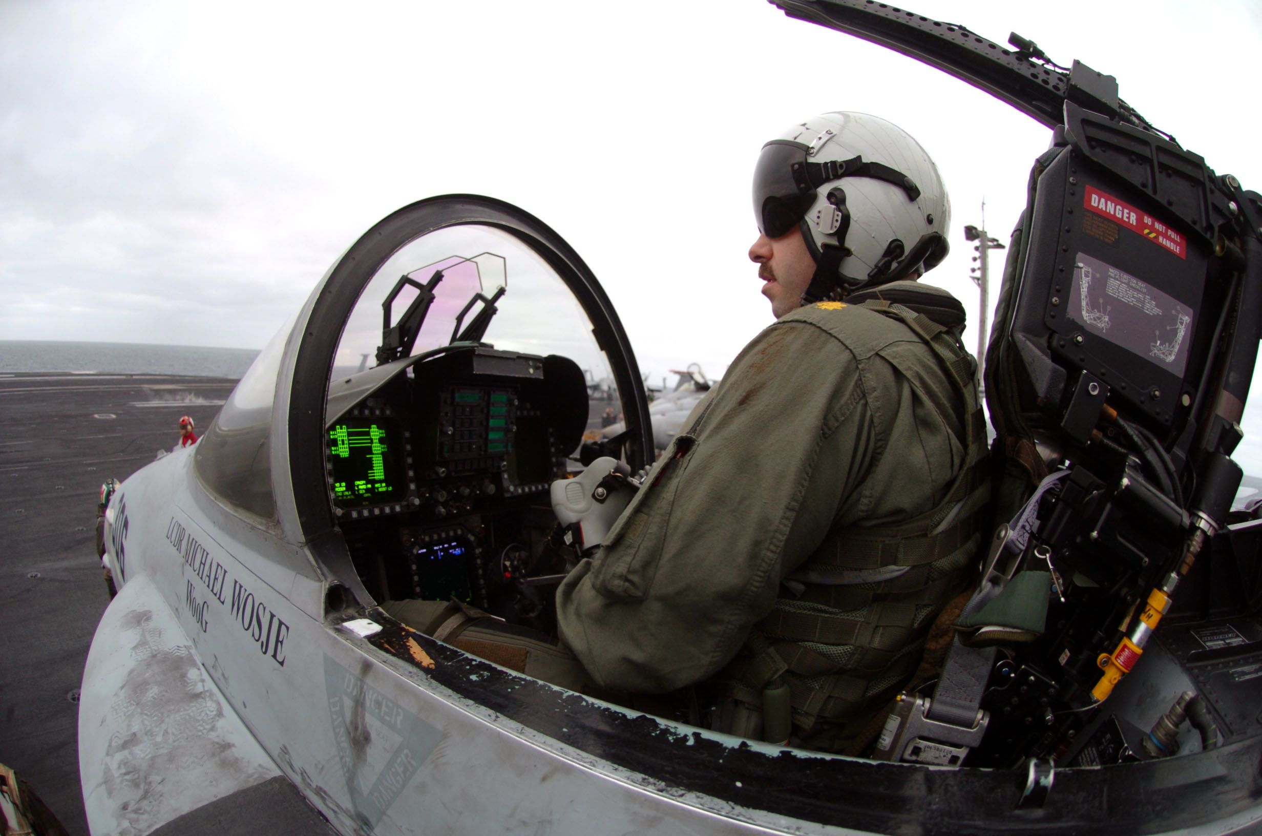 US_Navy_040406-N-6213R-338_Lt._Cmdr._James_Logsdon,_of_Roanoke_Rapids,_N.C.,_straps_into_the_cockpit_of_an_F-A-18C_Hornet.jpg