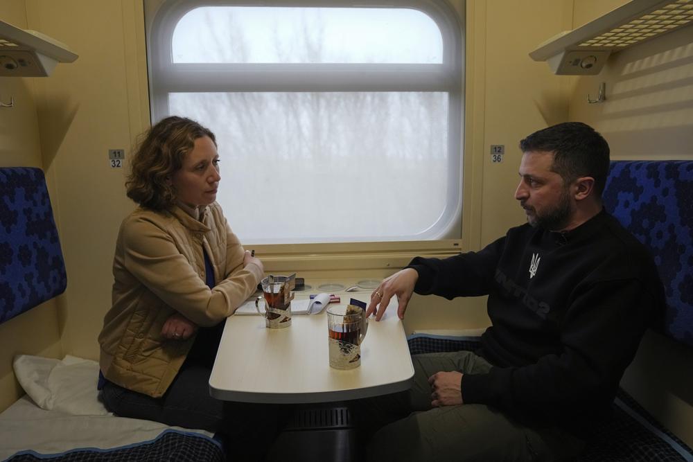 Ukrainian President Volodymyr Zelenskyy speaks during an interview with Julie Pace, senior vice president and executive editor of The Associated Press, on a train traveling from the Sumy region to Kyiv, Ukraine, Tuesday March 28, 2023. In the interview, Zelenskyy warned that unless his nation wins a drawn-out battle in the key eastern city of Bakhmut, Russia could begin building international support for a deal that could require Ukraine to make unacceptable compromises. (AP Photo/Efrem Lukatsky)