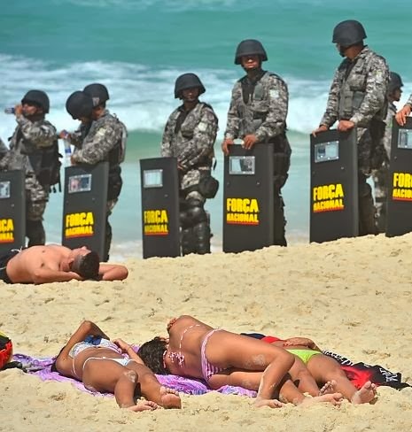 Brazil+army.Lazy+sunbathers+in+itsy-bitsy+bikinis+lap+hot+sexy+female+girl+women+naked+army+force+Rio%2527s+beaches+bra+panty+nakedmetresheavily-armed+riot+police+stand+guard+troop+soldier+%25282%2529.jpg