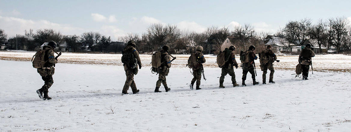 Snow progress: Ukrainian troops walk through a field near Bakhmut in February 2023