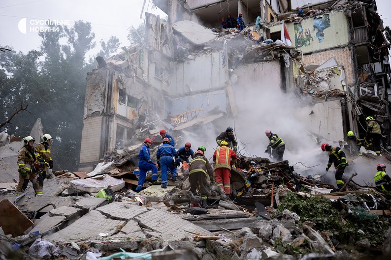Rescuers clear the rubble of a house in the Svyatoshynskyi district of Kyiv, July 31, 2025