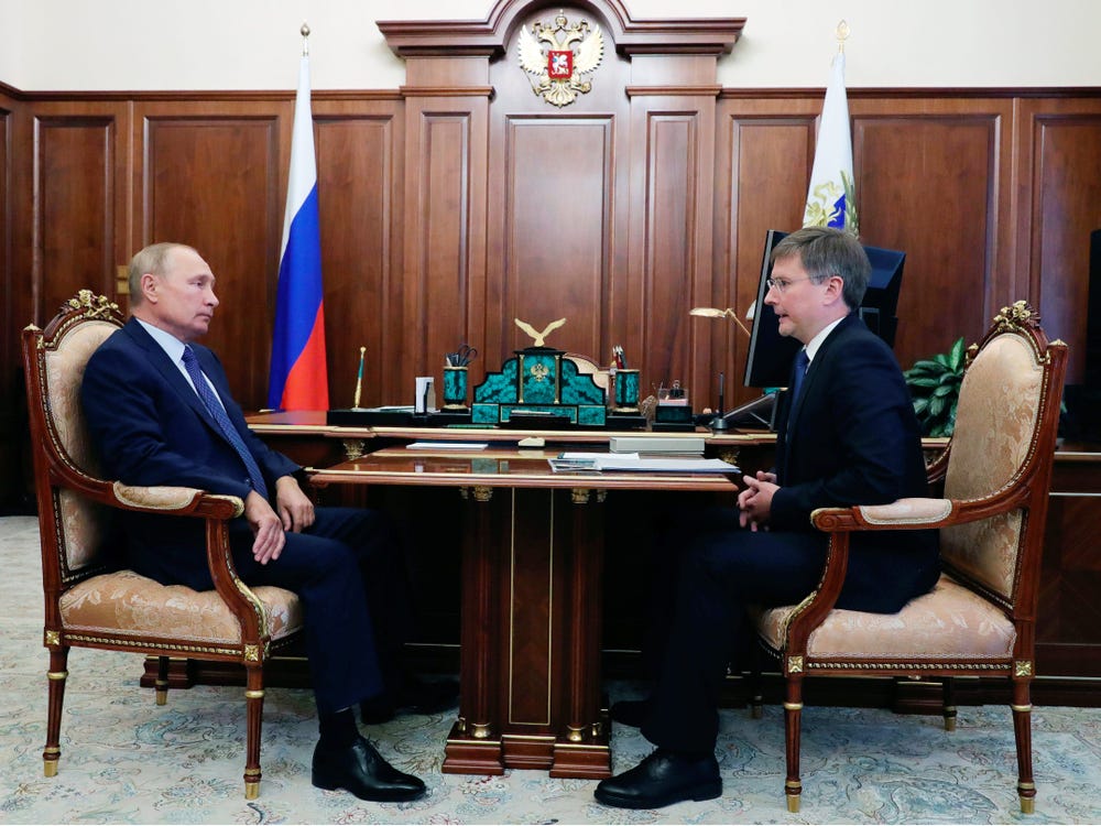 Russia's President Vladimir Putin (L) meets with Sergei Ivanov, CEO of the Alrosa diamond mining company, at the Moscow Kremlin.