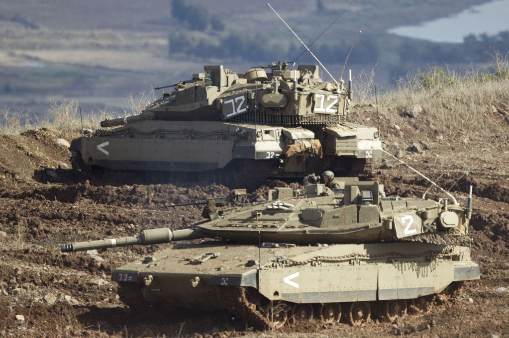 n+Israeli+tank+in+a+firing+position+in+the+Israeli-controlled+Golan+Heights+overlooking+the+Syrian+village+of+Bariqa,+Monday,+Nov.+12,+2012.+The+Israeli+military+says+Syrian+mobile+artillery+was+hit+after+respondin+(2).jpg