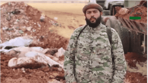 16-06-22-Muhaysini-denounces-Iran-Hezbollah-in-front-of-corpses-300x168.png