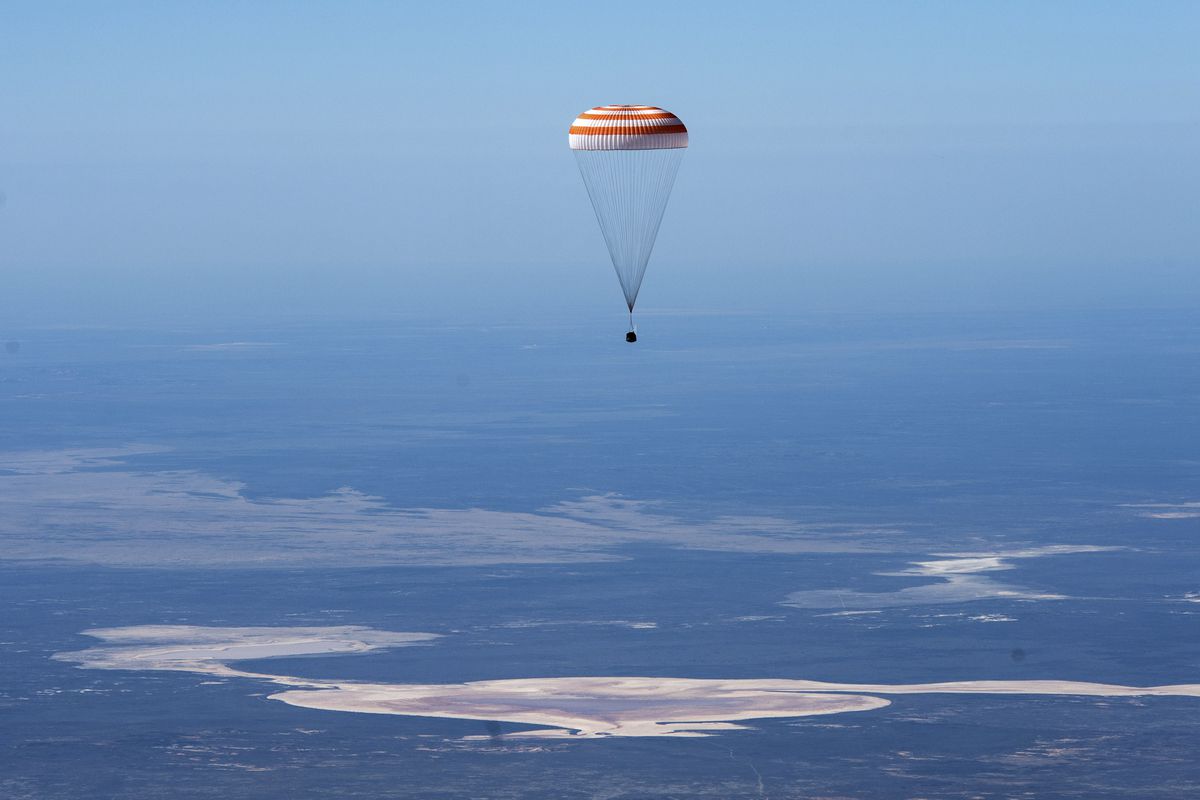 In this handout photo released by Gagarin Cosmonaut Training Centre (GCTC), Roscosmos space agency, the Soyuz MS-15 space capsule carrying International Space Station (ISS) crew members descends beneath a parachute just before landing in a remote area near Kazakh town of Dzhezkazgan, Kazakhstan, Friday, April 17, 2020.