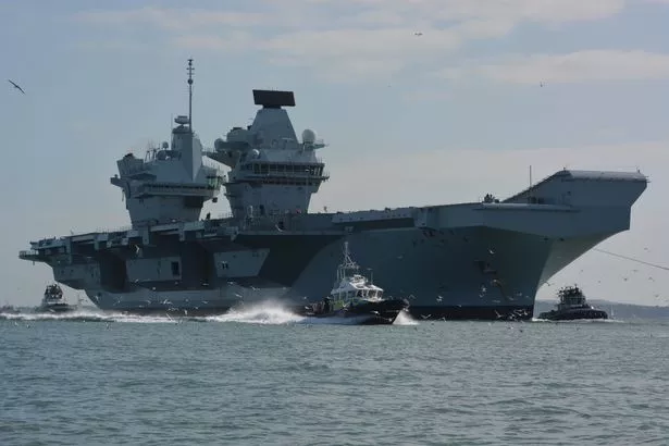Royal Navy aircraft carrier HMS Prince of Wales arriving into Portsmouth