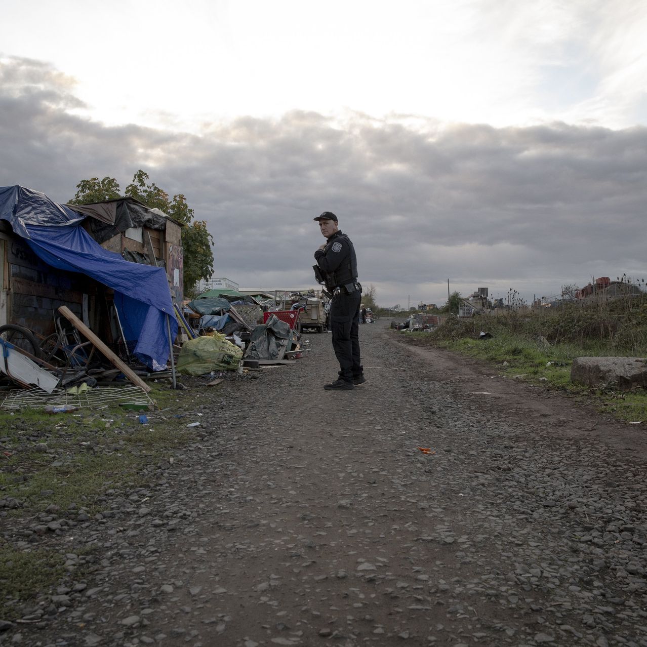 Officer Jose Alvarez of the Eugene Police Department recently visited an encampment for homeless people.
