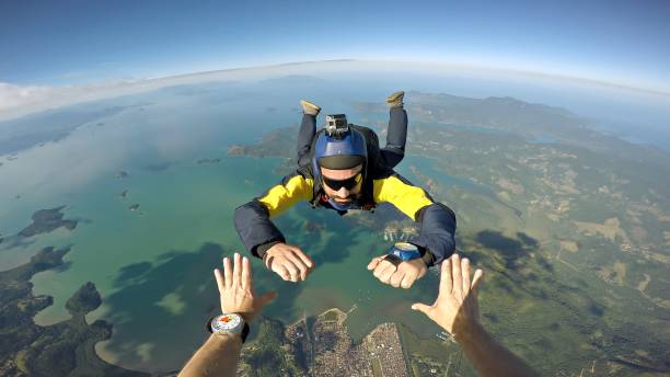 skydiver-point-of-view-above-the-beach-picture-id977149734