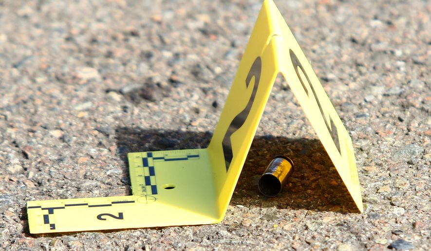 A bullet casing is marked at the scene of a deadly shooting at Umpqua Community College in Roseburg, Ore., Thursday, Oct. 1, 2015. (Michael Sullivan/The News-Review via AP) ** FILE **