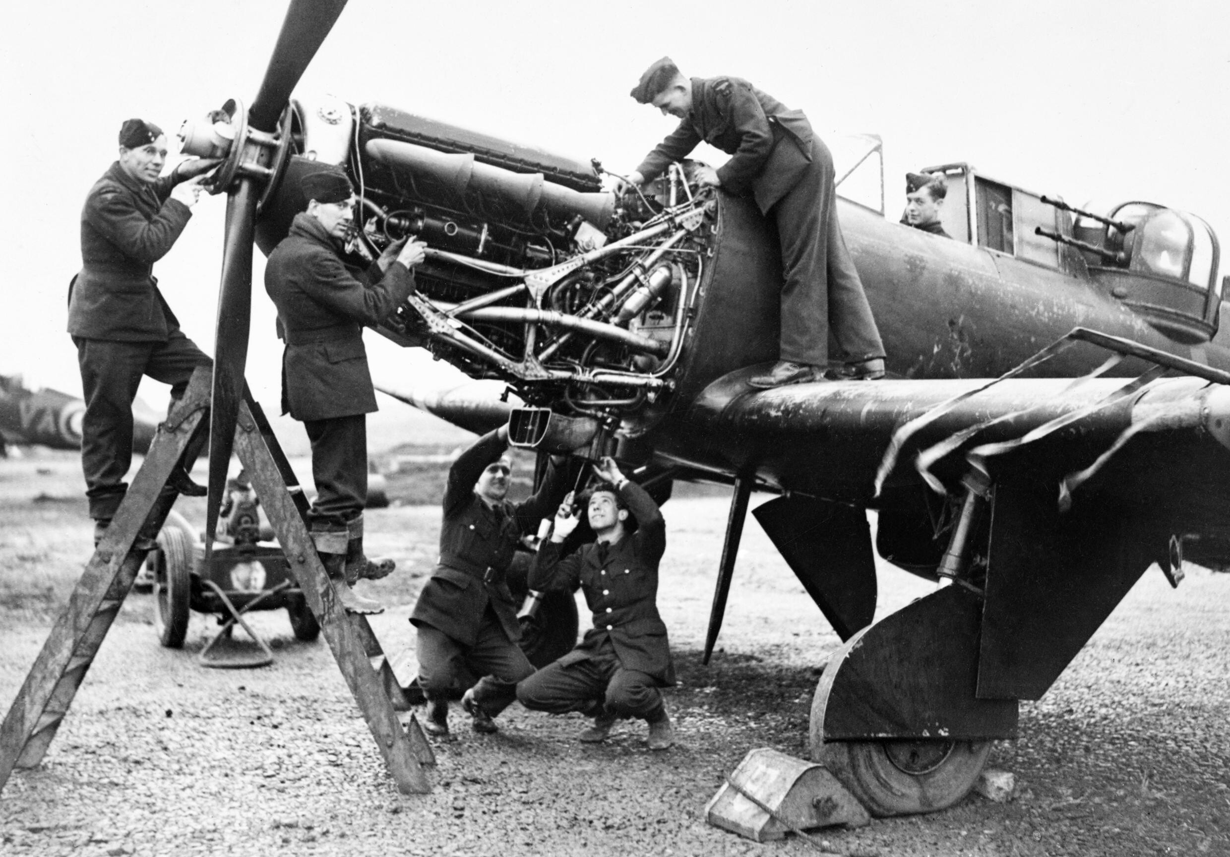 Fitters_working_on_the_Rolls-Royce_Merlin_engine_of_a_Boulton_Paul_Defiant_of_No._125_Squadron_RAF_at_Fairwood_Common%2C_Wales%2C_January_1942._CH4607.jpg