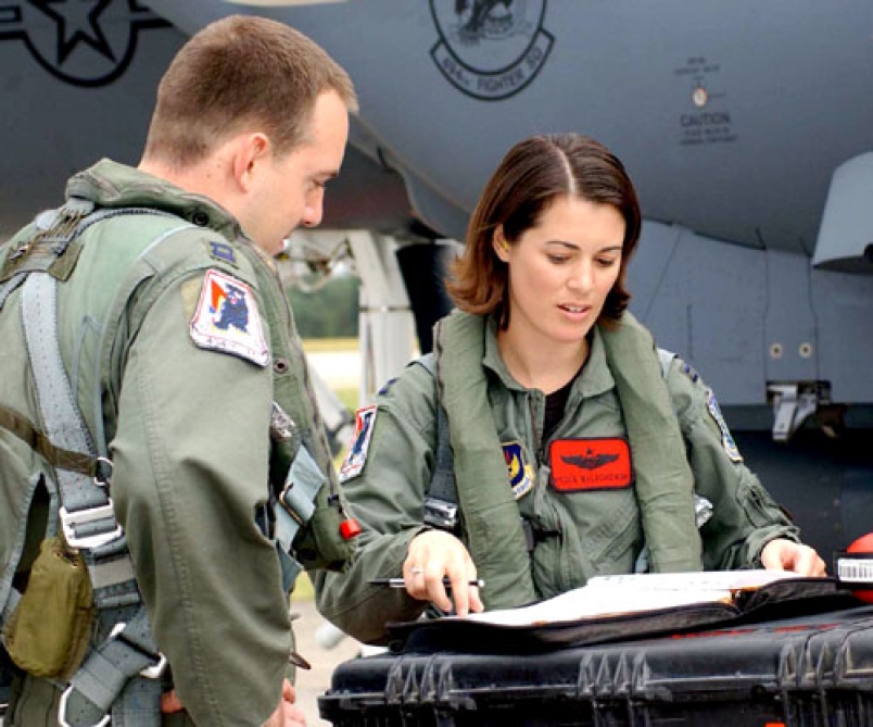 Capt._Nicole_Malachowski%2C_F-15E_female_pilot%2C_looks_over_checklists_before_flying_a_sortie_1763646018.jpg