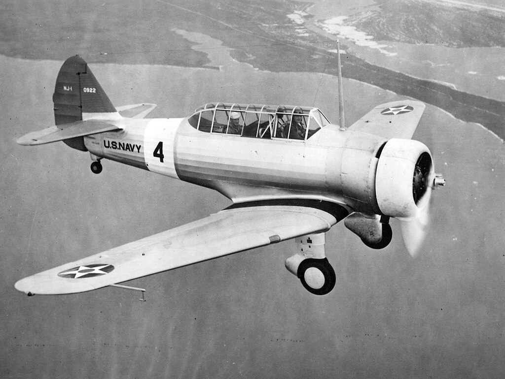 1024px-North_American_NJ-1_in_flight_1938.jpeg