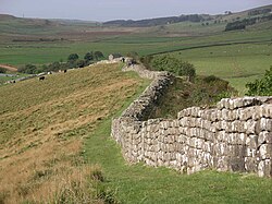 250px-Hadrian%27s_wall_at_Greenhead_Lough.jpg