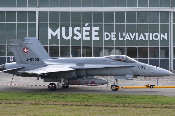 Jet fighter plane in front of a museum